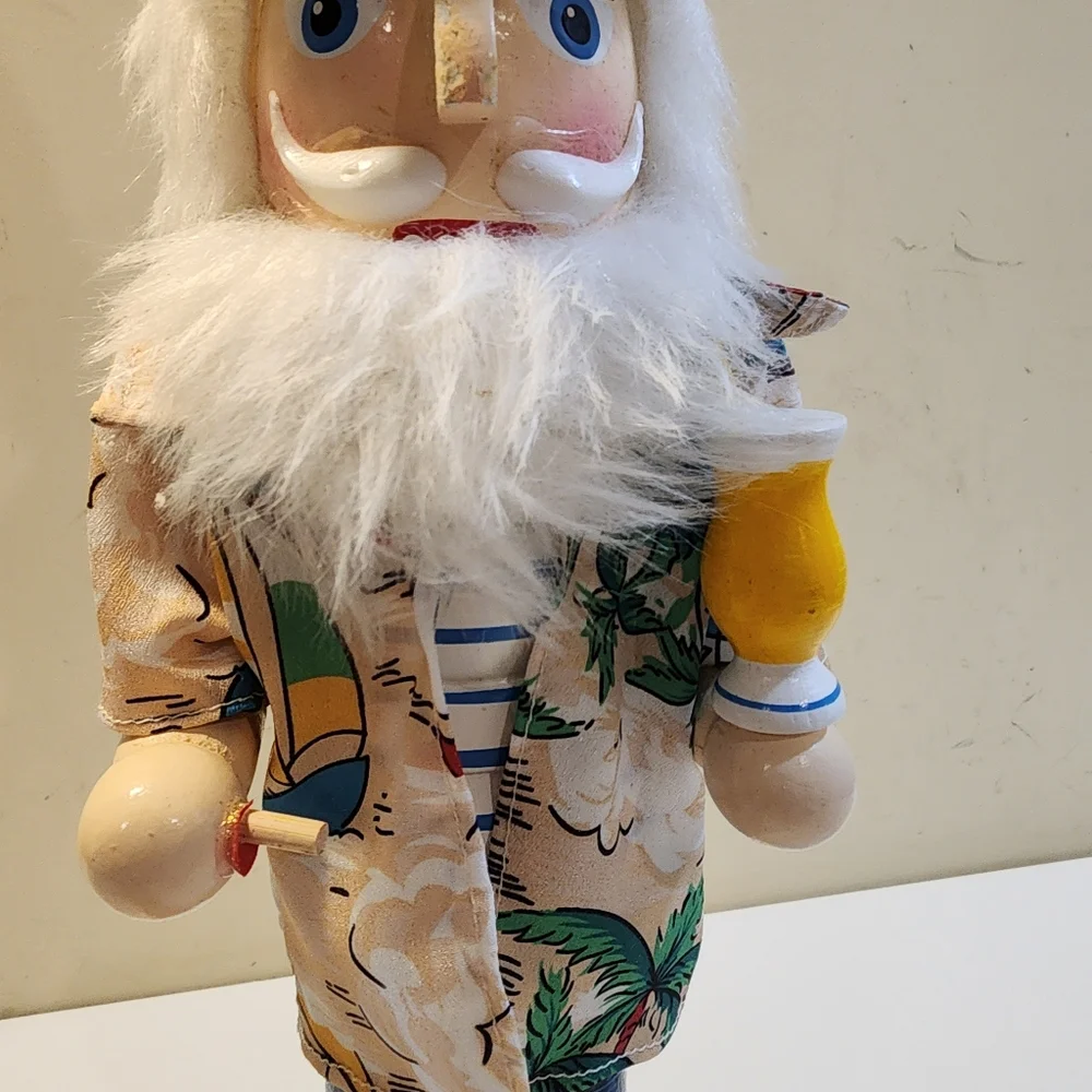 Wooden nutcracker styled as a Beachy  Santa Claus W/floral shirt, sunglasses